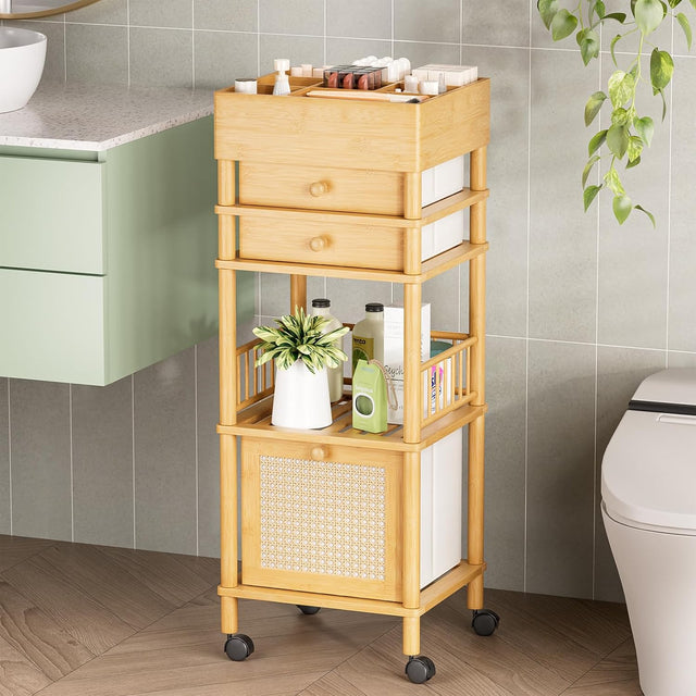 Bathroom storage cart with drawers and shelves against a tiled wall.