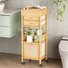 Bathroom storage cart with drawers and shelves against a tiled wall.