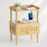 Wooden side table with a drawer, phone, and other items on a white background