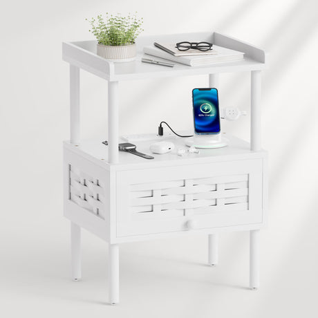 A white two-tier side table with a top shelf and a lower drawer, styled with a small potted plant.