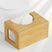 Wooden step stool in front of a toilet on a white background