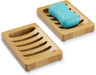 Bamboo soap dish with a bar of blue soap on a white background