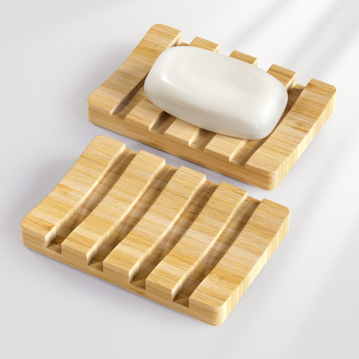 Wooden soap dish with a bar of soap on a light gray background