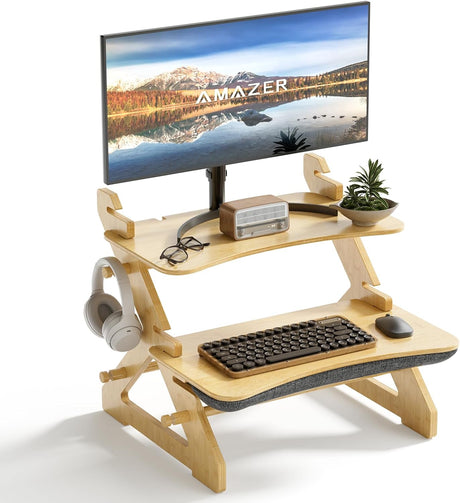 Wooden standing desk with monitor, keyboard, mouse, and headphones on a white background