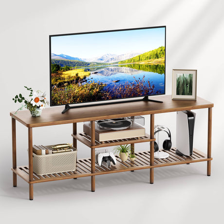 Wooden TV stand with a television displaying a nature scene, surrounded by decorative items.