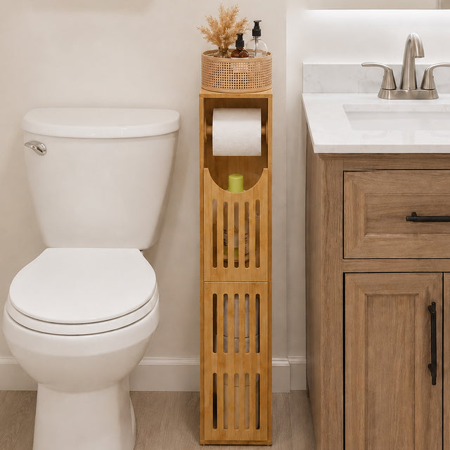 Bathroom with a bamboo wooden storage tower next to a toilet and vanity.