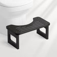 AmazerBath black bamboo toilet stool, 6.8-inch nonfoldable squat potty stool shown with a white toilet.