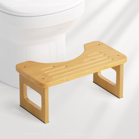 Wooden step stool in front of a toilet on a white background