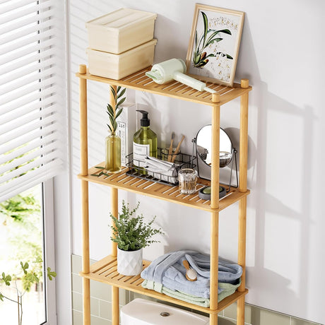 Wooden shelf with various items including a plant, bottles, and towels in a bright room.