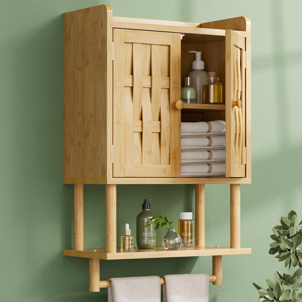 Bamboo cabinet with open doors displaying towels and bottles against a green wall.