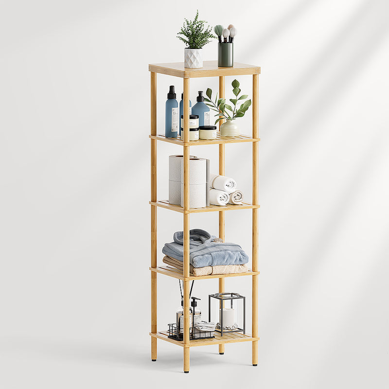 AmazerBath five-tier bamboo bathroom storage shelf styled with towels, toilet paper, bottles, plants, and small organizers.