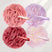Four mesh bath poufs in pink, purple, red, and multicolor with 'amazerBath' branding on a light gray background.