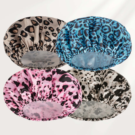 Four leopard print shower caps in different colors on a white background