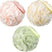 Three mesh bath pouf balls in pink, yellow, and green with 'AmazerBath' branding.