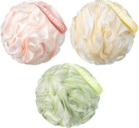 Three mesh bath pouf balls in pink, yellow, and green with 'AmazerBath' branding.