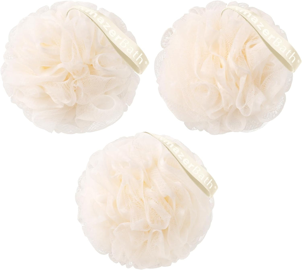 Three cream-colored bath poufs with a brand label on a white background