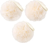 Three cream-colored bath poufs with a brand label on a white background