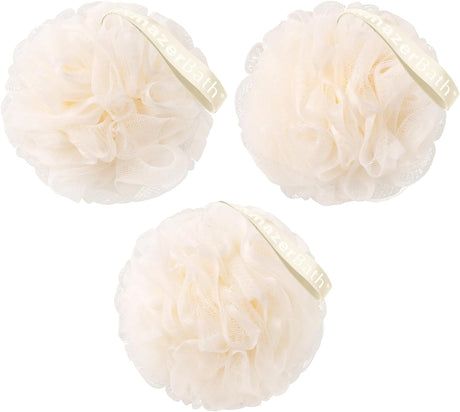 Three cream-colored bath poufs with a brand label on a white background