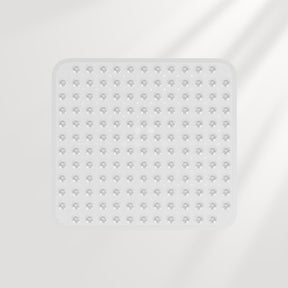 Clear square silicone mat with textured surface on a light gray background
