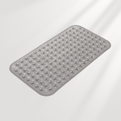 Gray bath mat with textured surface on a light gray background
