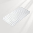 White bath mat with textured surface on a light gray background