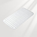 White bath mat with textured surface on a light gray background