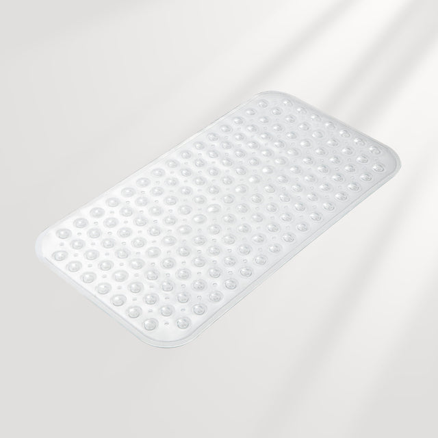 White bath mat with textured surface on a light gray background