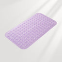 Purple bath mat with textured surface on a light gray background