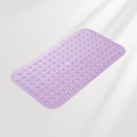 Purple bath mat with textured surface on a light gray background