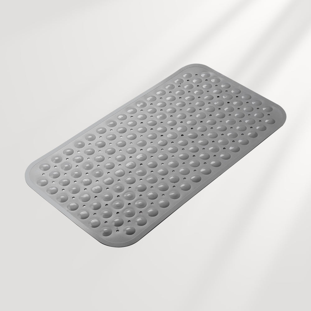 Gray textured bath mat on a light gray background