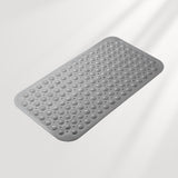 Gray textured bath mat on a light gray background