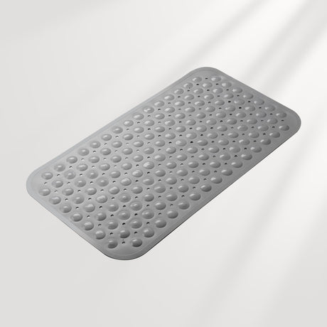 Gray textured bath mat on a light gray background