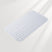 Silicone bath mat with textured surface on a light gray background