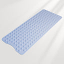 Blue bath mat with textured surface on a light gray background