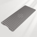 Gray textured bath mat on a light gray background