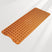 Brown bath mat with textured surface on a white background