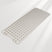 Rectangular bath mat with textured surface on a light gray background