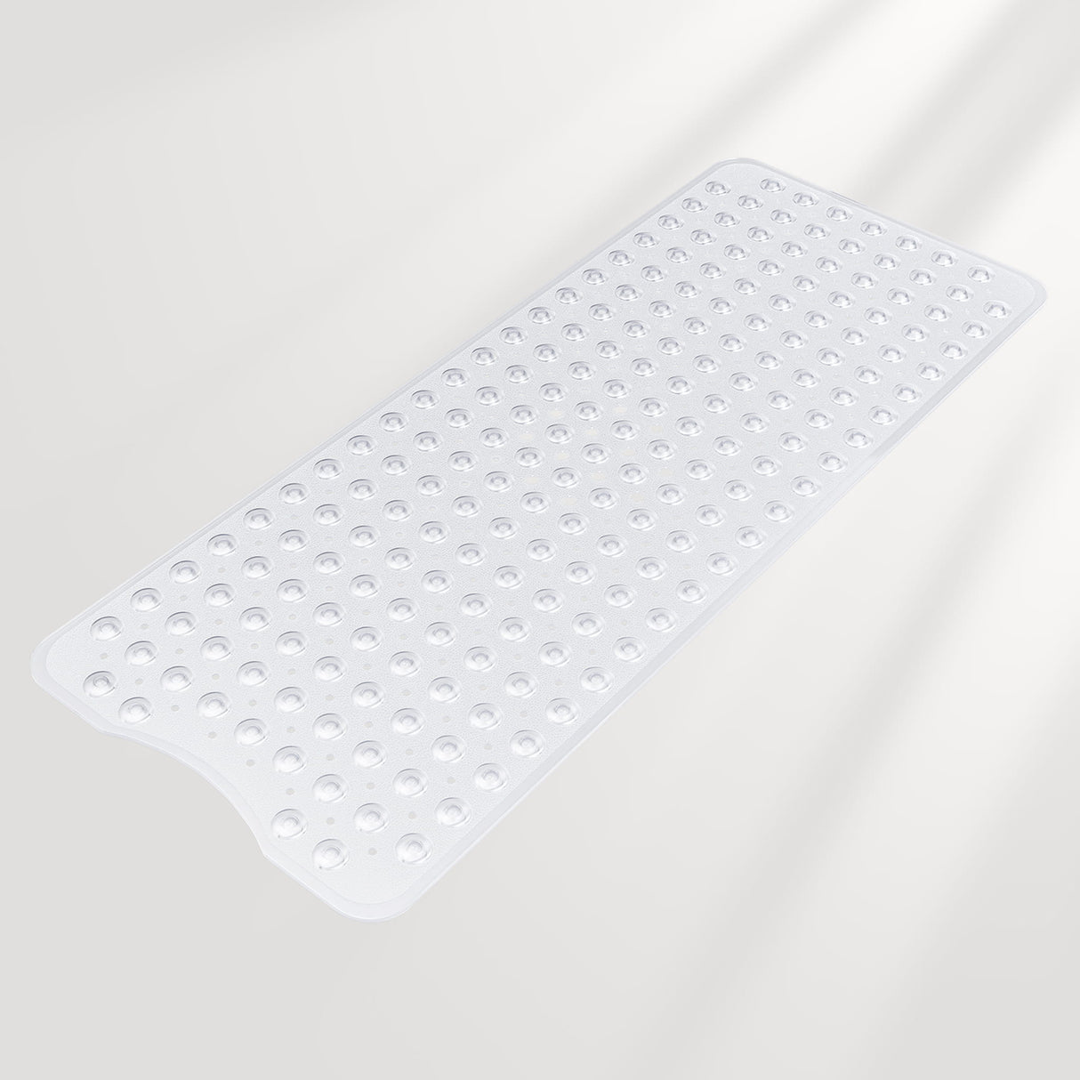 Clear bath mat with textured surface on a light gray background