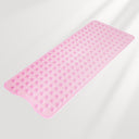 Pink bath mat with textured surface on a light gray background