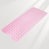 Pink bath mat with textured surface on a light gray background