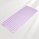 Purple bath mat with textured surface on a light gray background