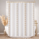 White shower curtain with gold geometric patterns in a bathroom setting.