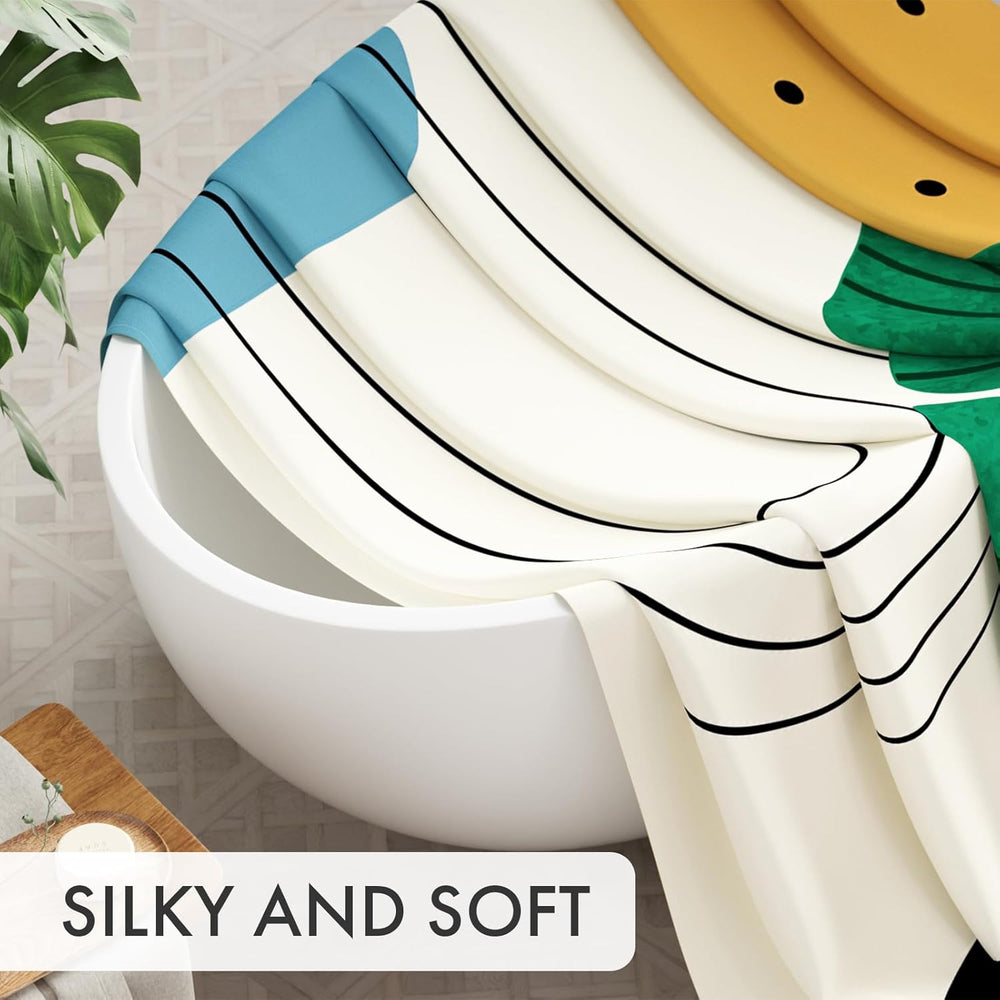 Striped curtain draped over a white bowl with a plant and soap in the background, labeled 'Silky and Soft'.