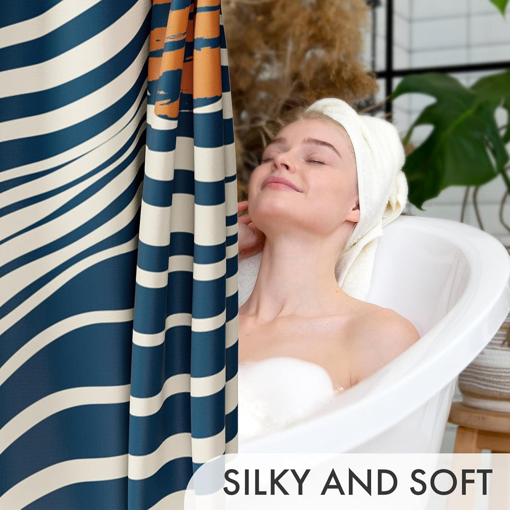 Woman in a bathtub with a striped shower curtain, surrounded by plants.