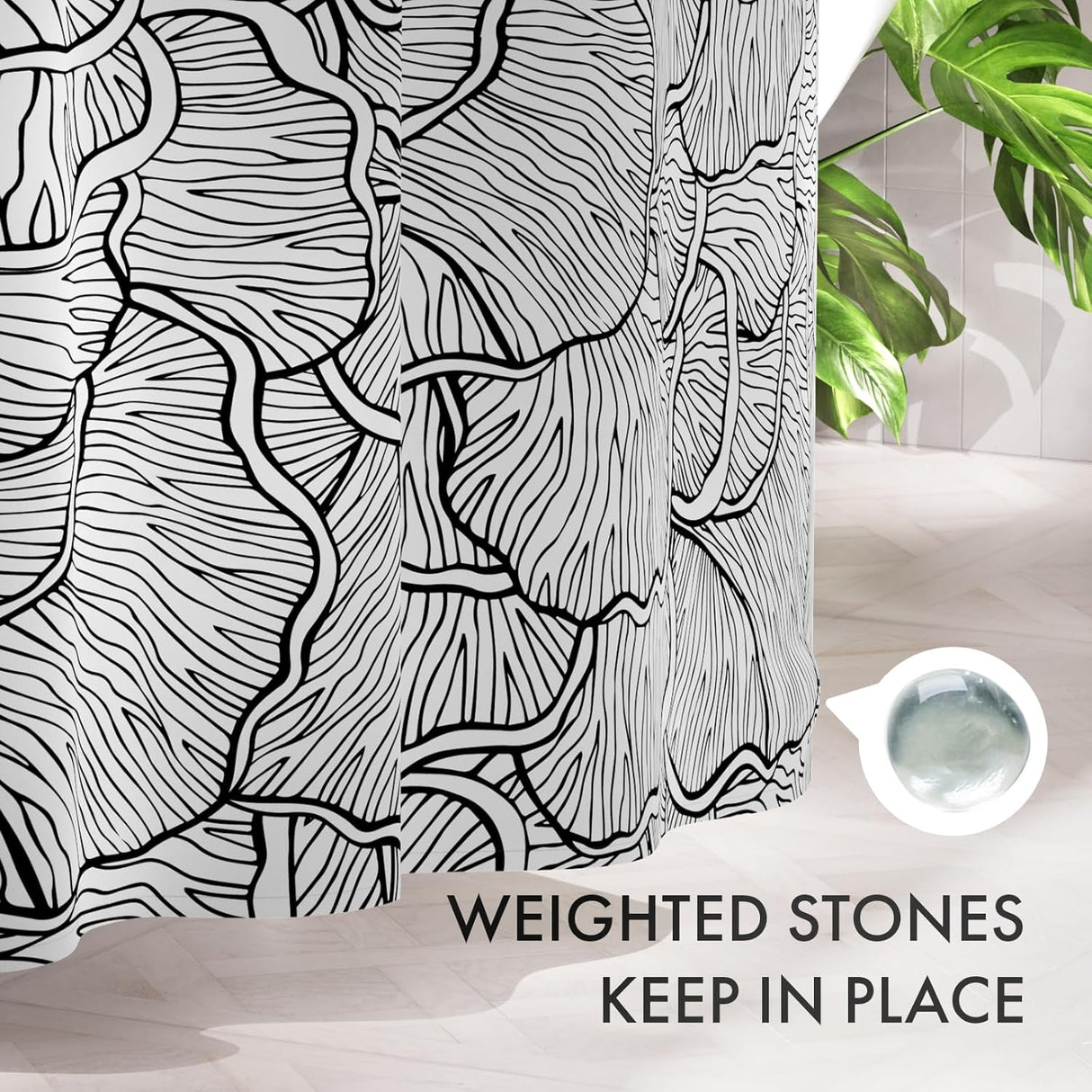 Black and white patterned shower curtain with text 'Weighted stones keep in place' on a bathroom setting.