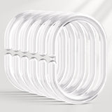 Set of clear plastic rings on a light gray background