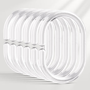 Set of clear plastic rings on a light gray background