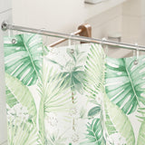 Tropical leaf patterned shower curtain in a bathroom setting