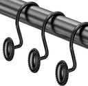 Black curtain rod with decorative hooks on a white background
