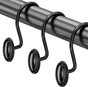 Black curtain rod with decorative hooks on a white background